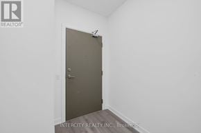 Brampton (Bram East) condo for rent - A room with a closed door and a brokerage logo.