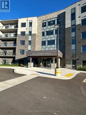 Kitchener house for rent - A building with the sign 1100 Linden Place in front of it.