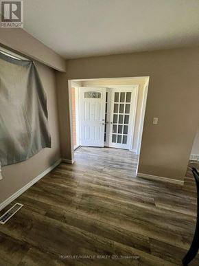 Welland (N. Welland) apartment for rent - A room with a white door and wooden flooring.