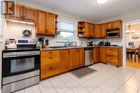Ottawa apartment for rent - A kitchen with wooden cabinets and stainless steel appliances.