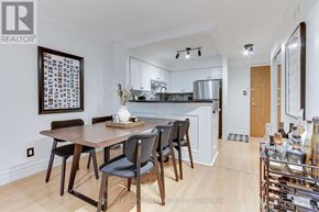Vaughan (Islington Woods) condo for rent - A modern kitchen with a dining table and chairs.