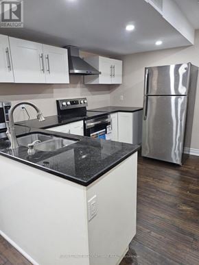 Milton (Sc Scott) apartment for rent - A kitchen with white cabinets and a black counter top.