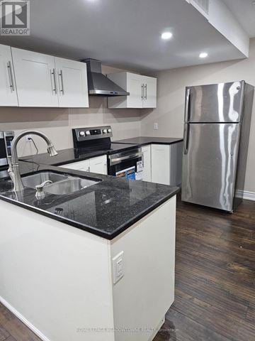 Milton (Sc Scott) apartment for rent - A kitchen with white cabinets and a black counter top.