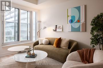Toronto (Waterfront Communities) condo for rent - A living room with a couch, a table, and a painting on the wall.
