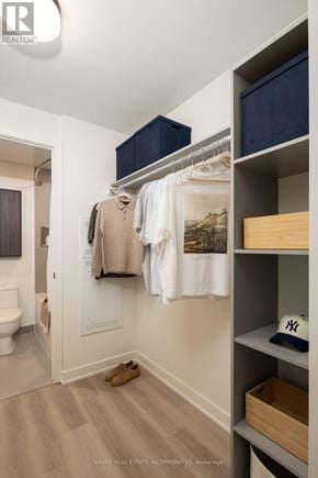 Toronto (Waterfront Communities) condo for rent - A hallway with a coat hanging on the wall and a pair of shoes on the floor.