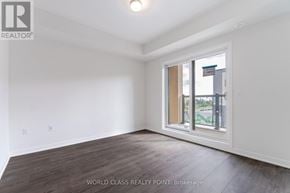 Mississauga (Erin Mills) townhouse for rent - A room with a window and wooden flooring.