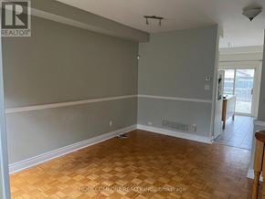 Vaughan (Vellore Village) apartment for rent - A room with wooden flooring and grey walls.