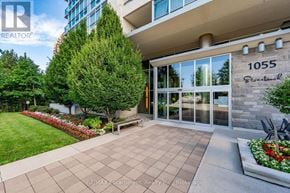Mississauga (Clarkson) condo for rent - The entrance to a building with the number 1055 on it.
