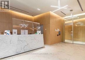 Toronto (Niagara) condo for rent - A reception area with a marble counter and wooden walls.