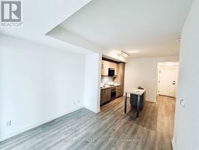 Markham (Unionville) condo for rent - A spacious room with a desk and a chair in it.