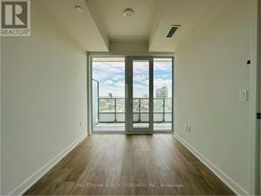 Toronto (Moss Park) condo for rent - A room with a sliding glass door leading to a balcony.