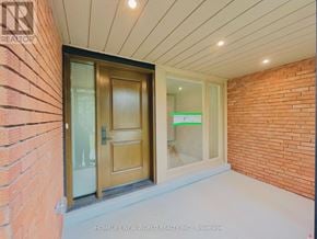 Toronto (St. Andrew-Windfields) apartment for rent - A doorway with a glass window and a wooden door.