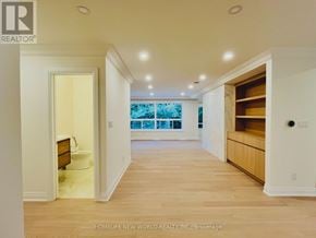 Toronto (St. Andrew-Windfields) apartment for rent - A spacious room with a view of the ocean through the windows.