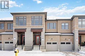 Whitby (Rolling Acres) townhouse for rent - A row of townhouses with a fire hydrant in front of the first one.
