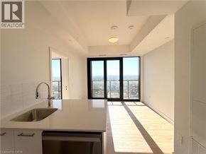 Kitchener condo for rent - A modern kitchen with a view of the city.