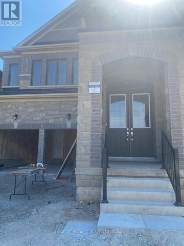 Brampton (Credit Valley) apartment for rent - A house with a black front door and a sign that says "HOMELIFE MIRACLE REALTY LTD. Bismarck.".