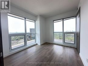 Toronto (Bayview Village) condo for rent - A room with a balcony and sliding glass doors.
