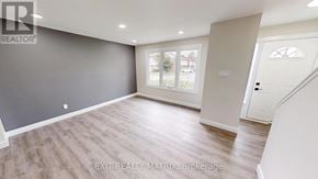Ottawa townhouse for rent - A room with a grey wall and a white door.