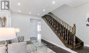 Milton (Fo Ford) apartment for rent - A spacious living room with a staircase leading to the upper floor.