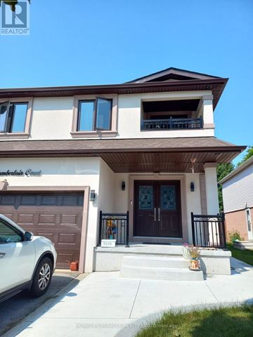 Mississauga (Meadowvale) apartment for rent - A white car is parked in front of a two-story house.