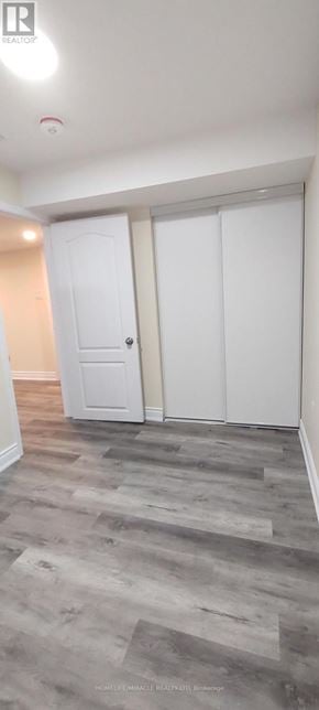 Mississauga (Meadowvale) apartment for rent - A room with a white door and a grey floor.