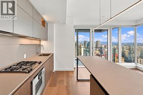 Vancouver apartment for rent - A modern kitchen with a view of the city.