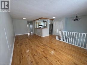 St. Catharines apartment for rent - A room with wooden floors and a white ceiling.