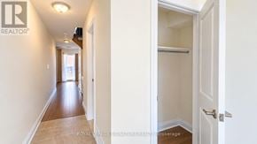 Vaughan (Beverley Glen) townhouse for rent - A hallway with a door on the right side.