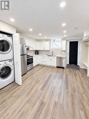 Hamilton (Stoney Creek Mountain) apartment for rent - A modern kitchen with a washer and dryer built in.