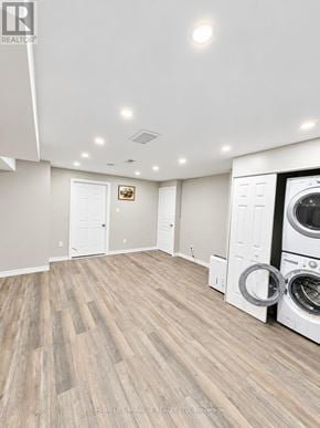 Hamilton (Stoney Creek Mountain) apartment for rent - A laundry room with a washer and dryer stacked together.
