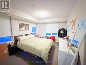 Toronto (Dovercourt-Wallace Emerson-Junction) condo for rent - A bedroom with a bed, a desk, and a closet.