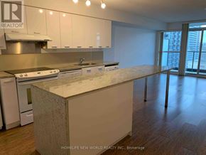 Toronto (Bayview Village) condo for rent - A kitchen with a counter top and cabinets.