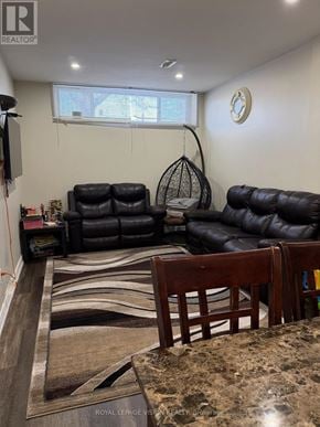 Toronto (Woburn) apartment for rent - A living room with a leather couch and a rug.