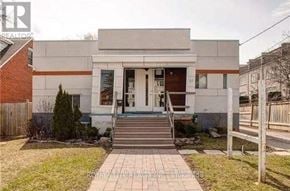 Toronto (Willowdale East) apartment for rent - A house with a front yard and a brick pathway leading to the front door.
