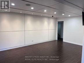 Toronto (Willowdale East) apartment for rent - A large, empty room with wooden flooring and white walls.