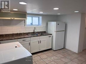 Toronto (Willowdale East) apartment for rent - A kitchen with white appliances and cabinets.