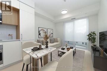 Toronto (Annex) condo for rent - A modern living room with a dining table and chairs.