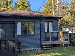 St. John's apartment for rent - A small house with a grey exterior and a brown roof.