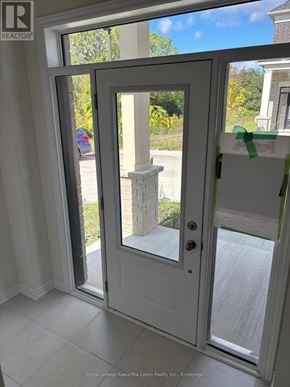 Kawartha Lakes (Lindsay) townhouse for rent - A white door with a glass window is open.