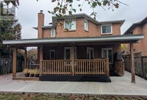 Mississauga (Hurontario) apartment for rent - A brick house with a porch and a covered patio.