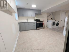 Mississauga (Hurontario) apartment for rent - A laundry room with a washer and dryer.