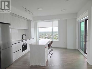 Mississauga (Central Erin Mills) condo for rent - A modern kitchen with a view of the city.