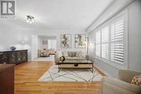 Mississauga (Meadowvale Village) apartment for rent - A well-lit living room with a wooden floor and white walls.