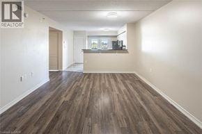 Milton condo for rent - A room with wooden flooring and a window.