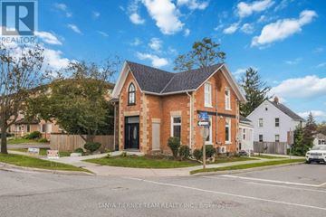 Oshawa (Central) apartment for rent - A house with a sign that says "Tanya Tierney Team Realty Inc Brokerage".