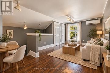 Oshawa (Central) apartment for rent - A well-lit living room with a dining table and chairs.