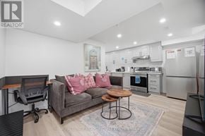 Mississauga (Meadowvale Village) apartment for rent - A living room with a grey couch and a wooden coffee table.