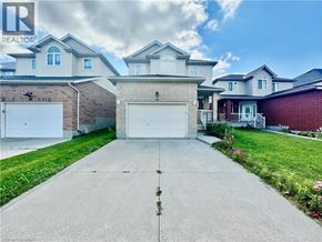 Cambridge apartment for rent - A large house with a driveway in front of it.