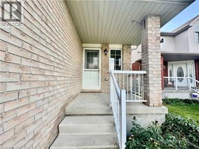 Cambridge apartment for rent - A house with a white door and a brick wall.