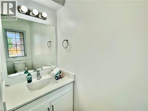 Cambridge apartment for rent - A bathroom with a sink, mirror, and towel.